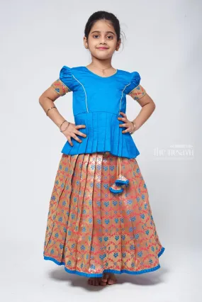 Charming Blue Silk Peplum Blouse with Zari Floral Pattu Pavadai: Perfect Celebration Wear for Girls